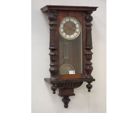 Late 19th early / 20th century Vienna clock, projected moulded cornice over glazed trunk enclosing gilt metal face, white cha