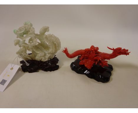 Chinese Jade carving of a lady and child with lotus flowers riding a phoenix and a coral carving of a dragon, with signature 