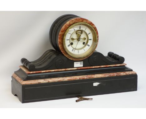 Black slate and marble late Victorian mantle clock, with drum head, white enamelled face, Roman numerals, open escapement fla