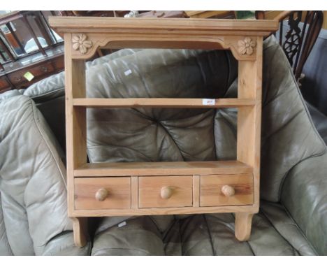 A modern pine wall shelf/drawers