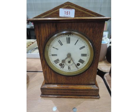 A mid20th Century oak mantle clock