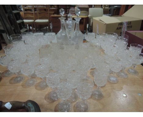 A selection of crystal wine and spirit glasses, etched decanters etc