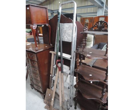 A set of aluminium step ladders and garden tools