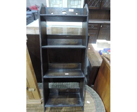 A 1920's oak narrow book shelf