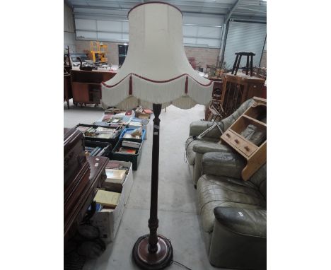 A traditional mahogany standard lamp