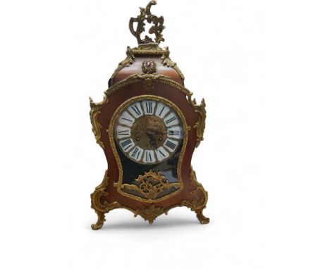 A French maple and gilt metal mounted cartouche shaped mantel clock, Roman numerals, 57cm high 
