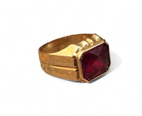 A 14ct gold gentleman's signet ring, set with an emerald cut red stone approx. 9 x 11.3mm, size R, hallmarked, 4.62g gross 