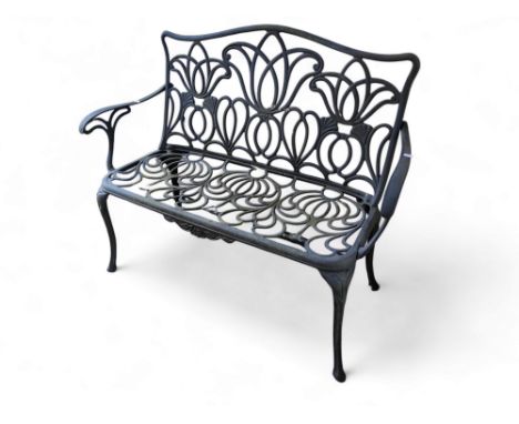A contemporary Art Nouveau style aluminium garden two seater bench. 