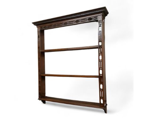 A Chinese Chippendale Revival oak open plate rack, dental cornice, 136cm high, 110cm wide 