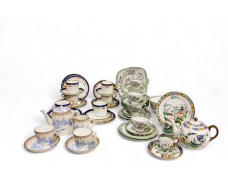 A Paragon part tea service, printed and painted with fanciful birds and foliage, comprising five cups, six saucers, twelve si