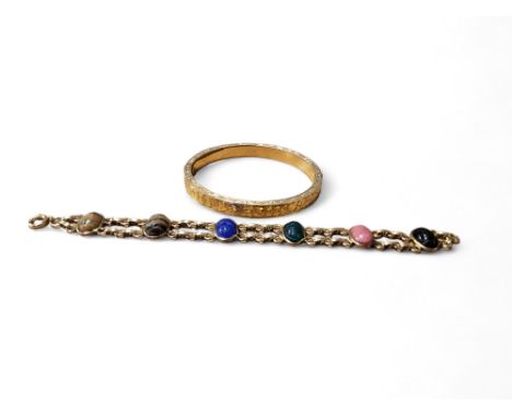 A&nbsp; bracelet, set with six scarab stones, 19cm long;&nbsp; a gilt metal bangle (2) 