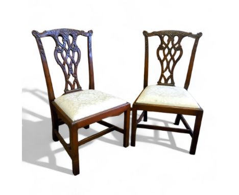 A pair of Chippendale Revival open hall chairs, profusely carved pierced splat, drop in seat, H-stretcher 