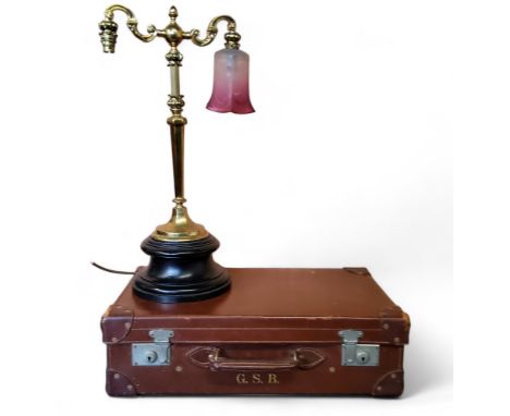 A 20th century brass two light side light, etched cranberry flashed shade, 63cm high;&nbsp; a mid 20th century suitcase, 36cm