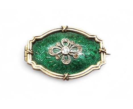 A yellow metal, diamond &amp; enamel brooch, the central green enamelled panel, surmonted white metal &amp; old cut diamond f