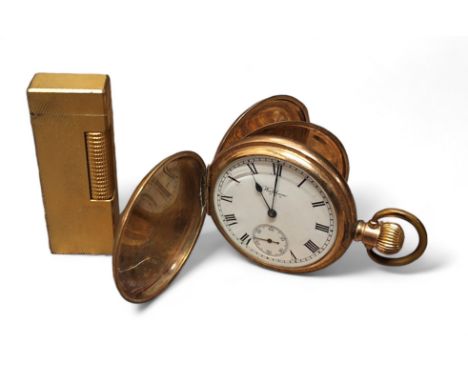 A Dunhill goldplated lighter; a gold plated full hunter pocketwatch, side winder movement stamped A.W.W Co. Waltham U.S.A. no