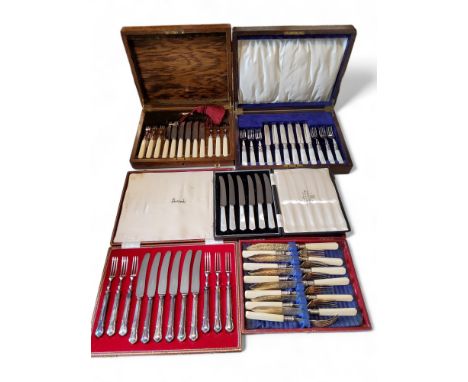 A set of six mother-of-pearl hafted fruit knivesand forks, cased;&nbsp; &nbsp;a set of six Harrods fruit knives and forks, ca