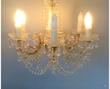 A glass crystal chandelier with 6 light fittings formally from The Queens Hotel ballroom