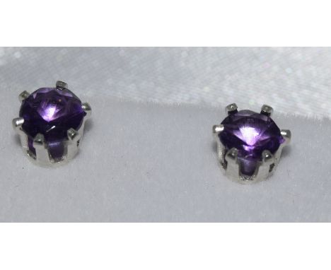 a pair of silver and amethyst stud earrings