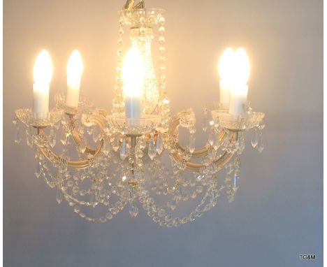 A glass crystal chandelier with 6 light fittings formally from The Queens Hotel ballroom