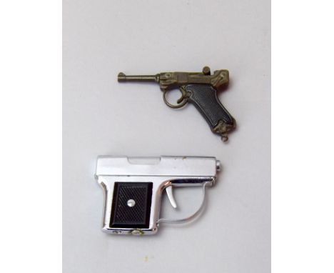 A novelty petrol lighter in the form of a derringer pistol 7.5cms long and a miniature cap firing Luger 7.5cms long 
