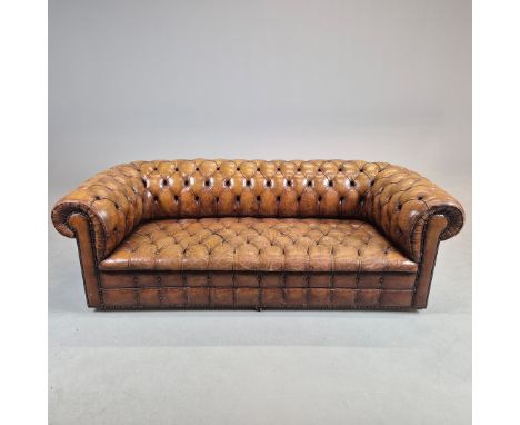 CHESTERFIELD SOFA. in brown buttoned leather 214cm l x 84cm d x 81cm t.