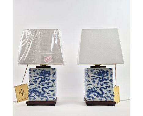 LAUREN RALPH LAUREN HOME TABLE LAMPS, A PAIR. blue and white glazed ceramic with dragon design, with shades, 40.5cm H approx.