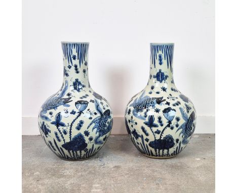 BOTTLE VASES. A pair, Chinese style blue and white ceramic, 59cm H approx. (2).