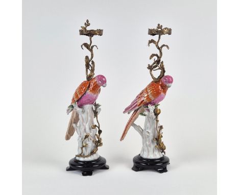 CANDLESTICKS. A pair, in the form of parrots, ceramic and gilt metal, 55cm H approx. (2).