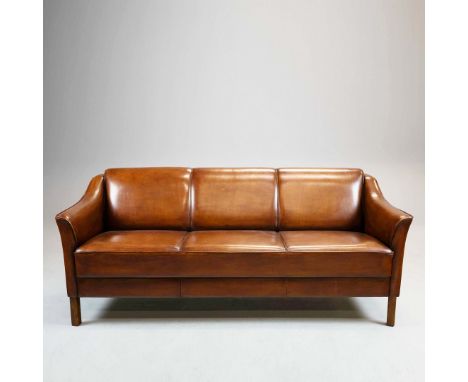 DANISH STYLE SOFA. Three seater grained mid brown piped leather  and teak, 75cm H x 181cm W x 78cm D.