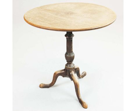 GEORGE III TILT-TOP MAHOGANY TRIPOD TABLE. the rounded top raised on turned column and three legs with pointed pad feet. 70cm