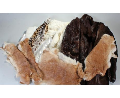 Vintage fur items to include a white fur cape, brown fur coat, leopard skin collar and four pelts. (7)