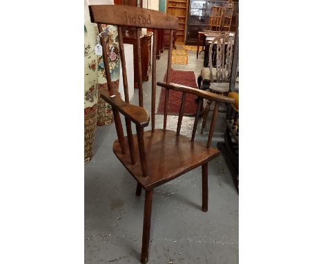 Traditional Welsh Ash primitive stick backed fireside chair, the overhanging top rail marked 'Hafod', on solid seat with thre