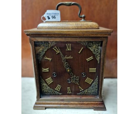 Junghans three train bracket style oak cased clock. (B.P. 21% + VAT)