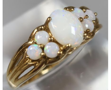 9ct gold seven stone opal dress ring. 1.8g approx. Size M1/2.  (B.P. 21% + VAT)