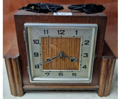 Art Deco design oak framed two train mantel clock marked Foreign. With key and pendulum. (B.P. 21% + VAT)