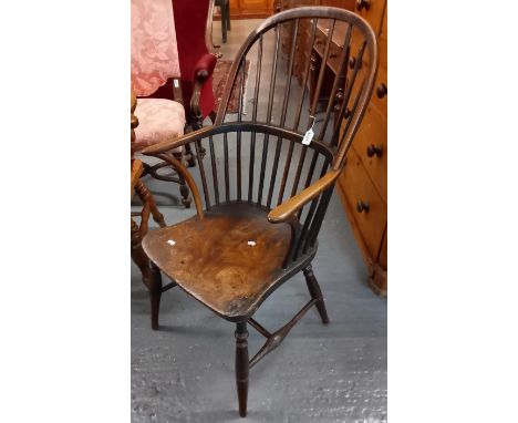 19th century ash and elm stick backed Windsor elbow chair, with moulded saddle seat on baluster turned legs with straight str