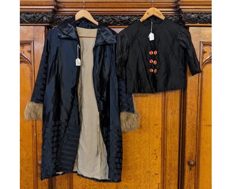 Early 20th century dark ice blue coat, buttons to one side and fur cuffs, together with a black blouse with six striped butto