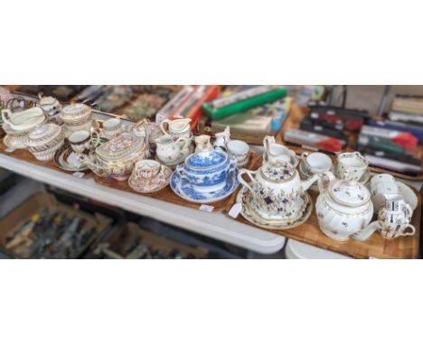 Three trays of assorted mainly 18th and 19th century English porcelain teapots, cream jugs, coffee cans and teacups and sauce
