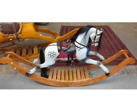 20th century painted carousel type rocking horse with natural mane and tail, leather saddle and bridle, dapple grey painted o