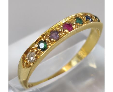 18ct gold channel set multi stone ring set with diamond, emerald, ruby and sapphire. 2.6g approx. Size P1/2. (B.P. 21% + VAT)