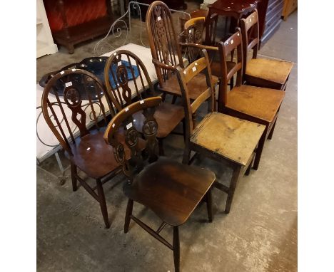 Group of assorted dining/kitchen chairs including: Ercol, wheel backed elbow chair and three 19th century Welsh oak farmhouse