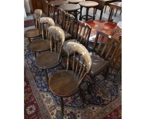 Set of four early 20th century beech and elm kitchen chairs, with turned stick backs on circular seats with turned legs. toge