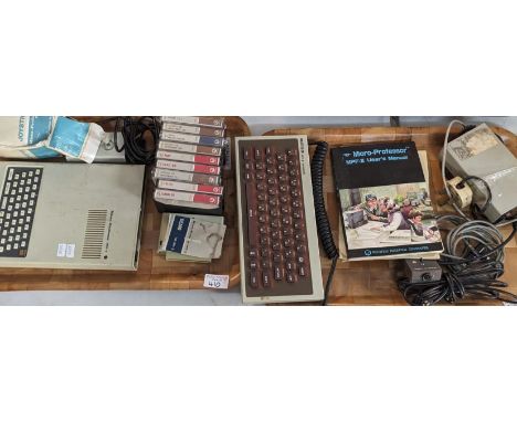 A Micro-Professor II (MPF-II) computer, to include: external keyboard, power supply, joystick, demo cartridge, manual and '9'