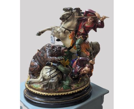 Polychrome painted figure group of a battle/hunting scene between figures on horses with snarling bear. On naturalistic, gilt