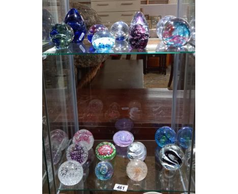A collection of paperweights including Caithness