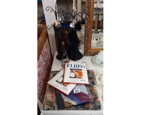 Figural jewellery stands, stockings, scarf and bag, all new and sealed in bags