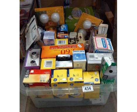 A box of light bulbs and adapters/plugs