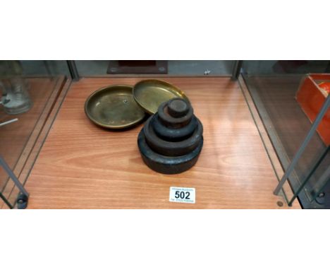 A quantity of weights and 2 brass dishes off a set of scales
