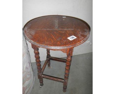 A small circular table on bobbin twist supports, COLLECT ONLY.