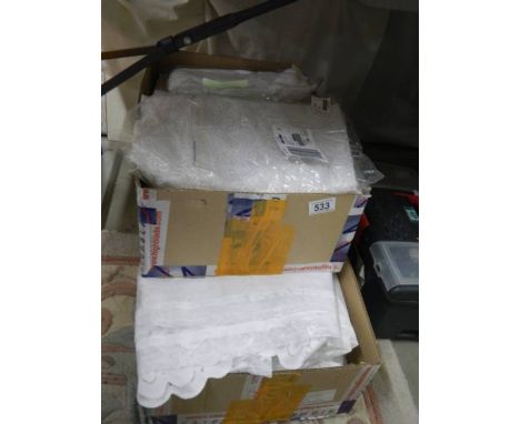 A quantity of modern net curtains.